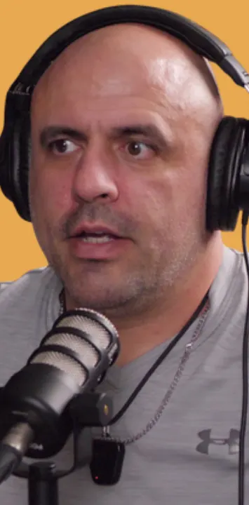 Dan, mid-sentence at his microphone
